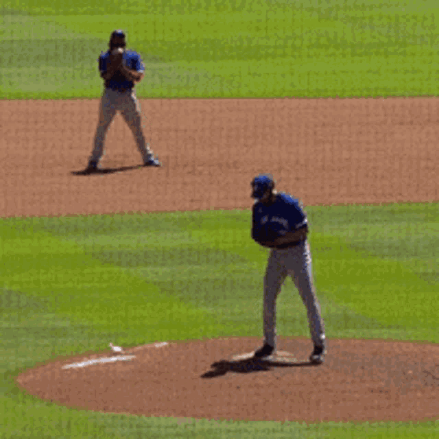 two baseball players on a field with one wearing a jersey with the number 3 on it