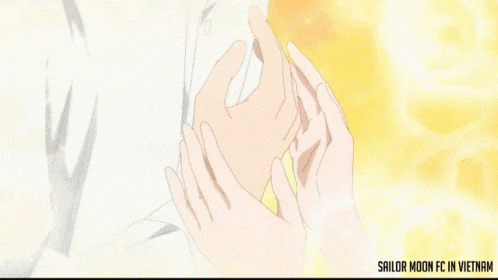 a man and a woman are holding hands with the words sailor moon fc in vietnam on the bottom