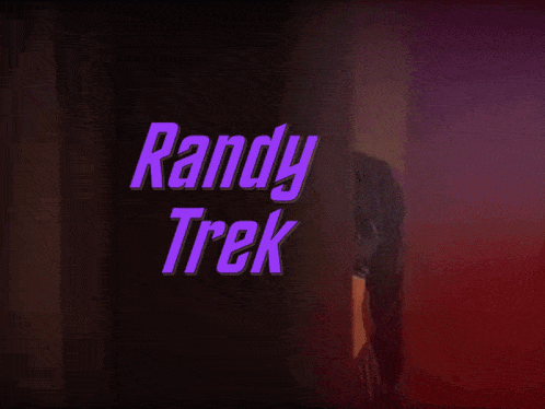 a woman is standing in front of a sign that says andy trek on it