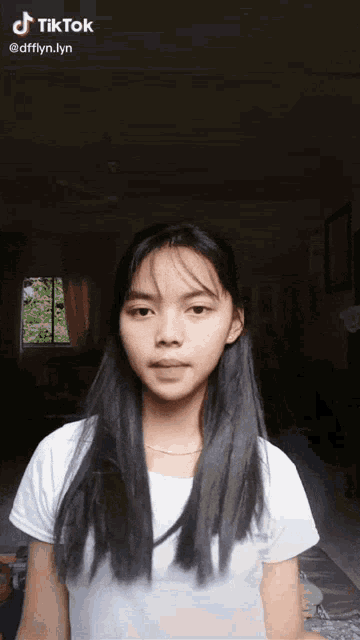 a girl 's face is shown in a tik tok video