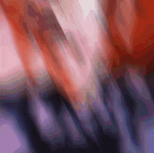 a blurry picture of a person 's arm with a red and purple background