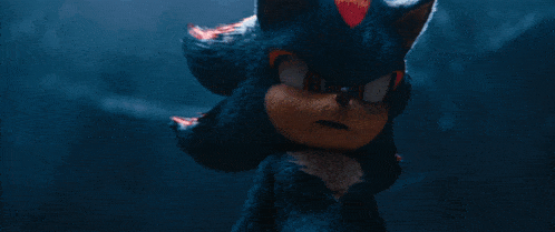 shadow the hedgehog from the video game sonic the hedgehog is holding something in his hand