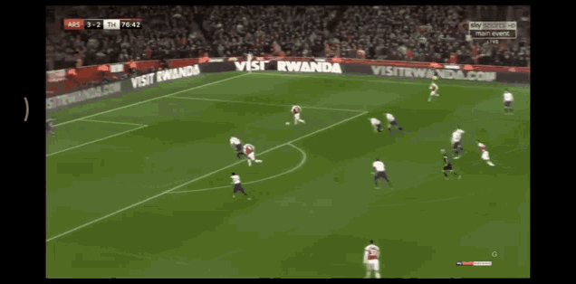 a soccer game is being played in front of a sign that says visit wanda