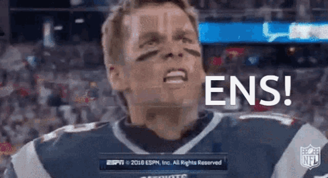 a football player with the word ens on the screen behind him
