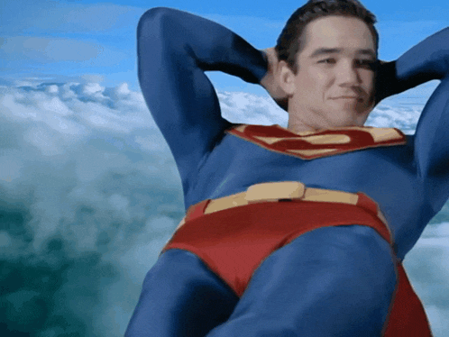 a man in a superman costume is flying through the clouds