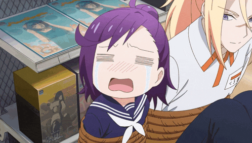 a girl with purple hair is tied up and crying in front of a shelf of magazines