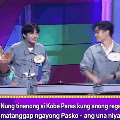 a man in a denim jacket with the name alex on his name tag