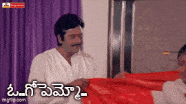 a man in a white shirt is holding a red cloth in front of a woman