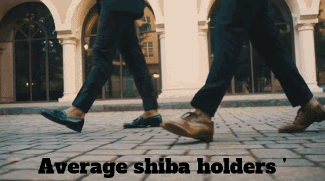 two people walking on a brick sidewalk with the words average shiba holders