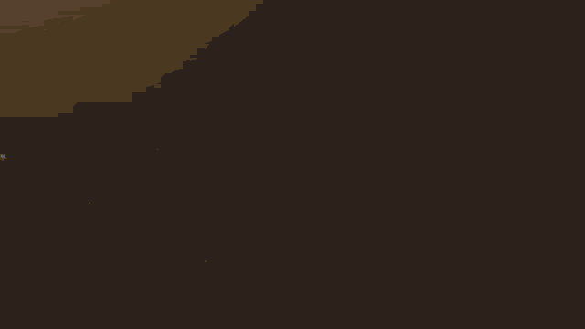 a man sits at a table with a cup of coffee