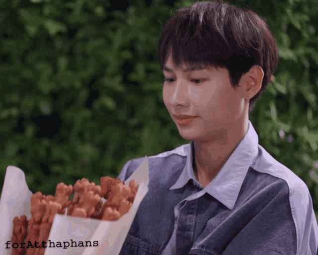 a person holding a bag of food with the name forathaphans written on the bottom