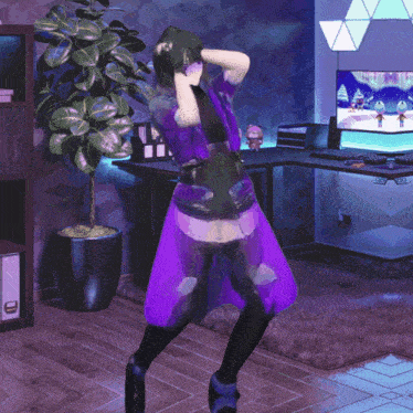 a person in a purple outfit is dancing in front of a computer monitor