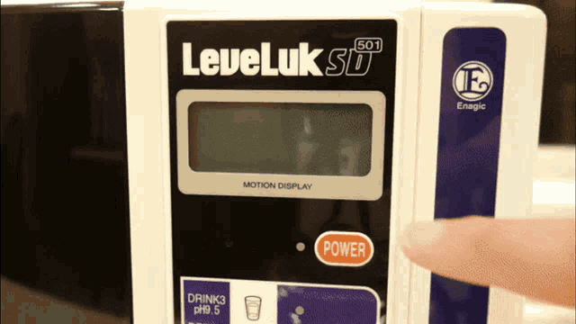 a person is pressing a power button on a leveluk sd device