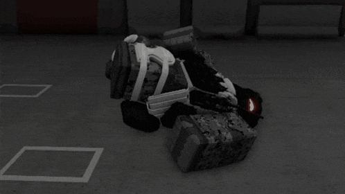 a black and white image of a person laying on a pile of boxes