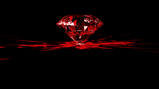 a red diamond on a black background with a red light behind it