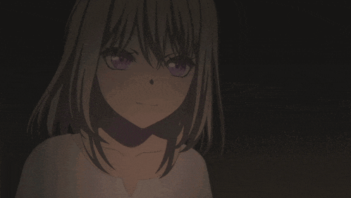a close up of a girl with purple eyes making a silly face
