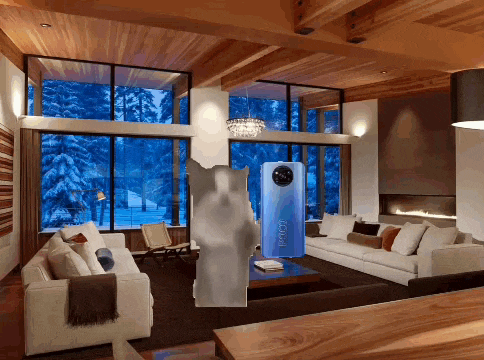 a living room with a white couch and a blue box that says ' ioioi ' on it