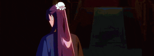 a woman with long purple hair is standing next to a man