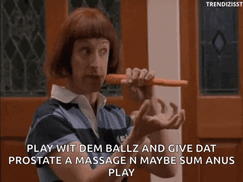 a man with red hair is holding a carrot in his mouth and says " play wit dem ballz "