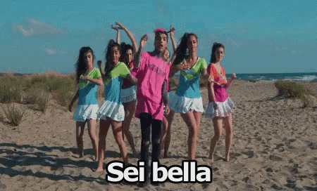 a group of girls are dancing on a beach with the words sei bella written on the bottom