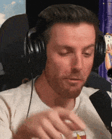 a man wearing headphones and a white shirt