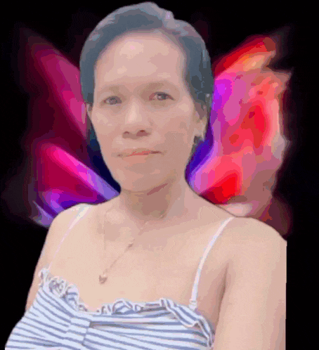 a woman in a striped top is standing in front of a butterfly background