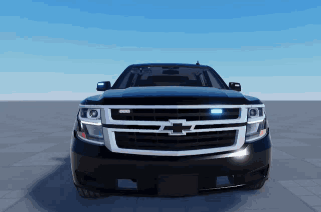 the front of a black chevrolet suv is shown