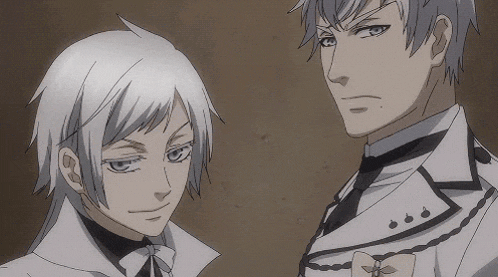a couple of anime characters are standing next to each other