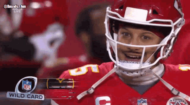a football player wearing a helmet with a wild card nfl logo behind him
