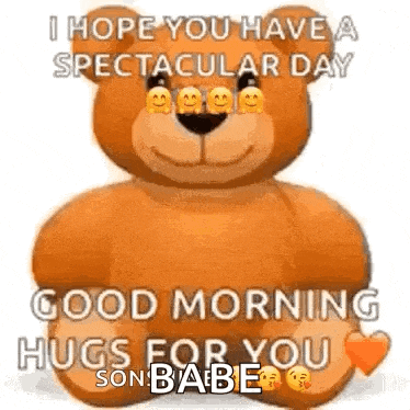 a teddy bear is sitting on a bed with a good morning hugs for you .