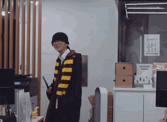 a man in a harry potter costume stands in front of a sign that says " always "