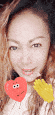 a close up of a woman 's face with a red heart and a yellow flower .