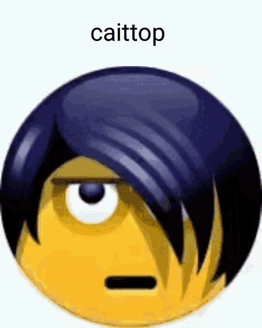 a yellow smiley face with black hair and the words `` caittop '' written on it .