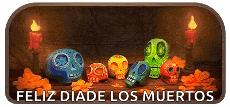 a group of colorful sugar skulls are sitting on a wooden table with candles .