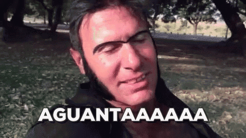 a man with a beard is making a funny face and the words aguantaaaa are above him