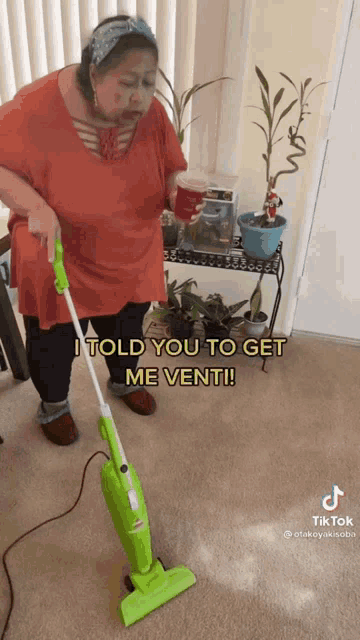 a woman is using a vacuum cleaner and says i told you to get me vent
