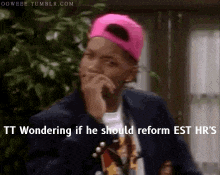 a man wearing a pink hat is wondering if he should reform est hrs
