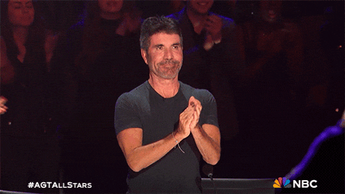 a man with his arms in the air is on nbc 's agt all stars