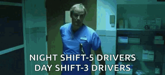 a man in a blue scrub top is standing in a hallway with the words night shift -5 drivers