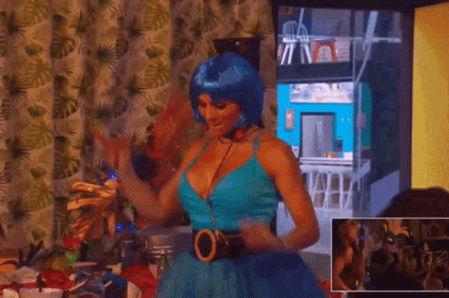 a woman in a blue wig is holding a drink in her hand