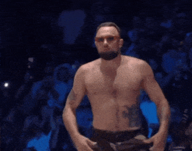 a man named craig jones stands in front of a crowd of people