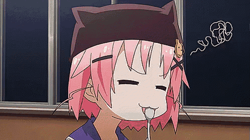 a girl with pink hair and a cat ear hat is licking a spoon