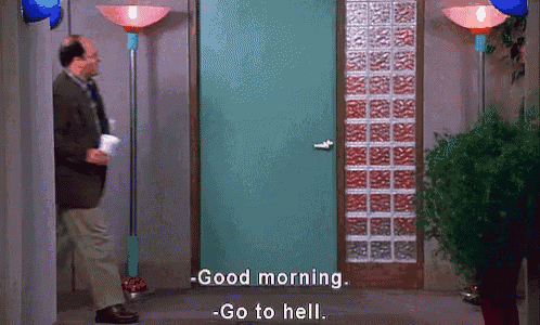 a man in a suit and tie is walking through a door and says good morning .