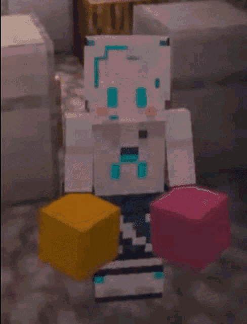 a minecraft character is holding a yellow and pink block .
