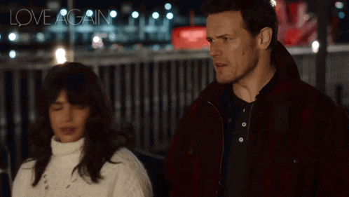 a man and a woman are standing next to each other and the words love again are visible in the background