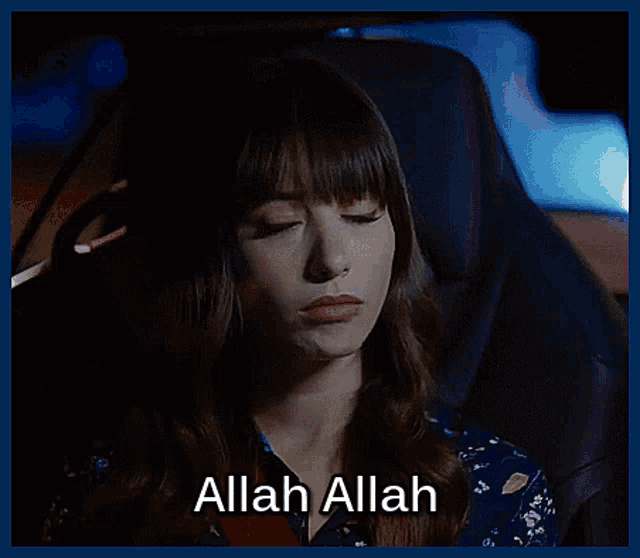 a woman sitting in a car with the words allah allah written on the bottom
