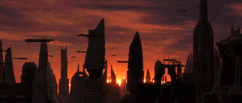 a sunset over a futuristic city with lots of buildings