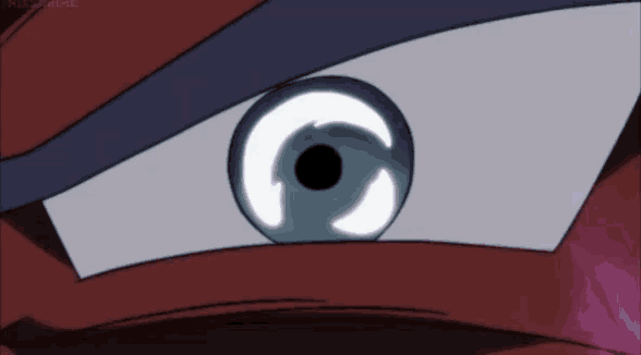 a close up of a cartoon character 's eye with a black pupil