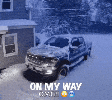 a truck is stuck in the snow in front of a house
