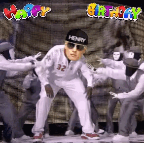 a man wearing a henry hat is surrounded by a group of dancers